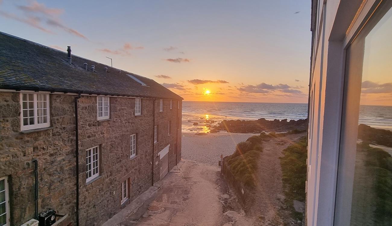 Watch the sunset over Porthmeor Beach to top off a memorable day.