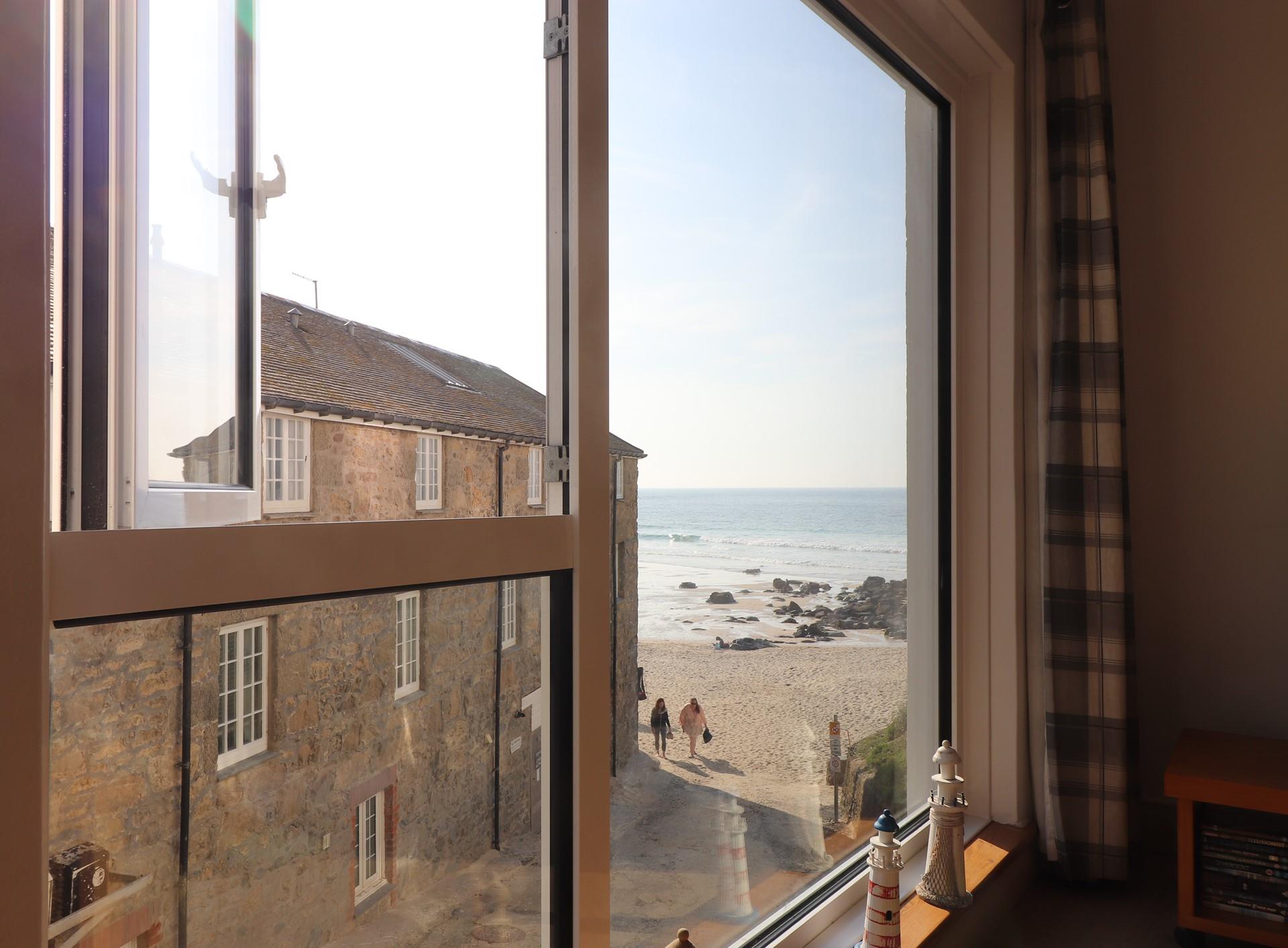 Gaze out at sea from your sitting room window, then wander down in the sunshine.