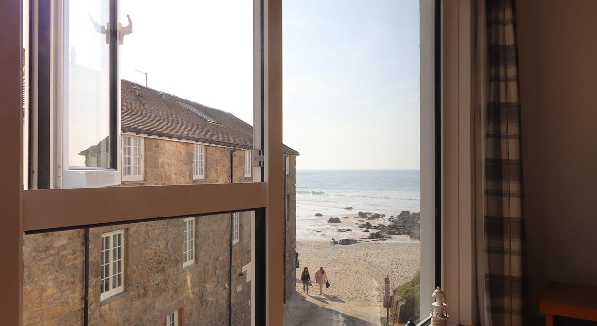 Gaze out at sea from your sitting room window, then wander down in the sunshine.