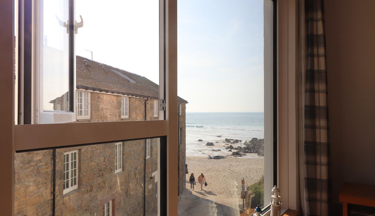 Gaze out at sea from your sitting room window, then wander down in the sunshine.