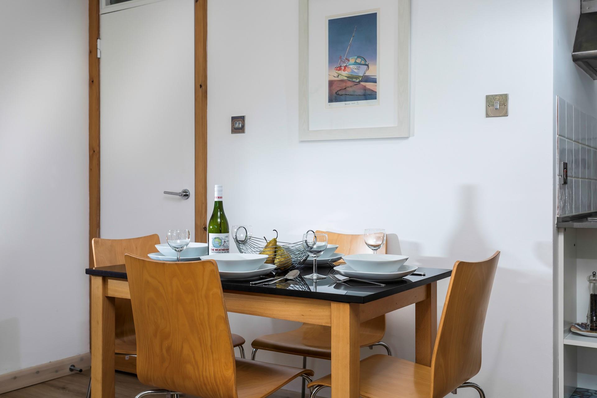 The dining table is ideally placed to converse with the dedicated chef!