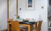 The dining table is ideally placed to converse with the dedicated chef! - Thumbnail Image