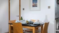 The dining table is ideally placed to converse with the dedicated chef!