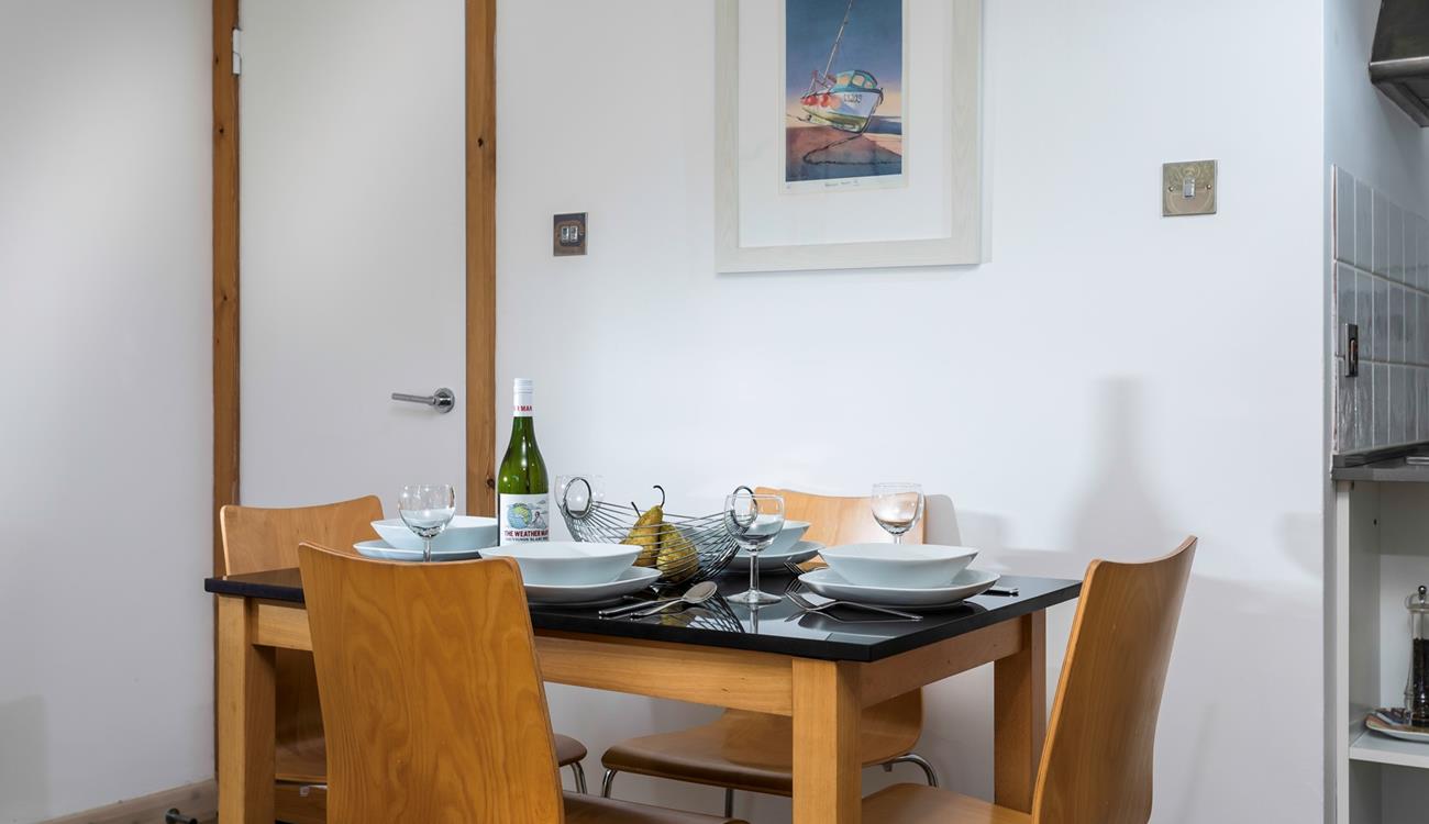 The dining table is ideally placed to converse with the dedicated chef!