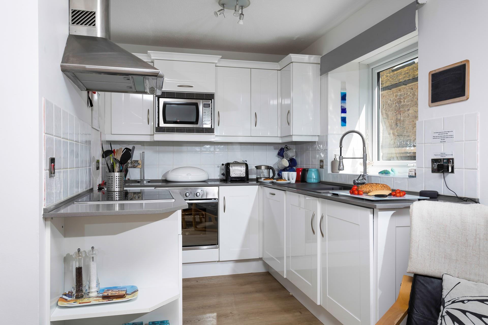 The open plan kitchen is bright and practical.