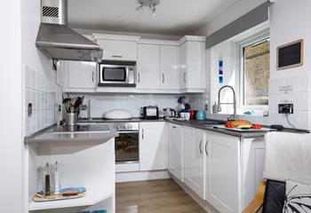 The open plan kitchen is bright and practical.