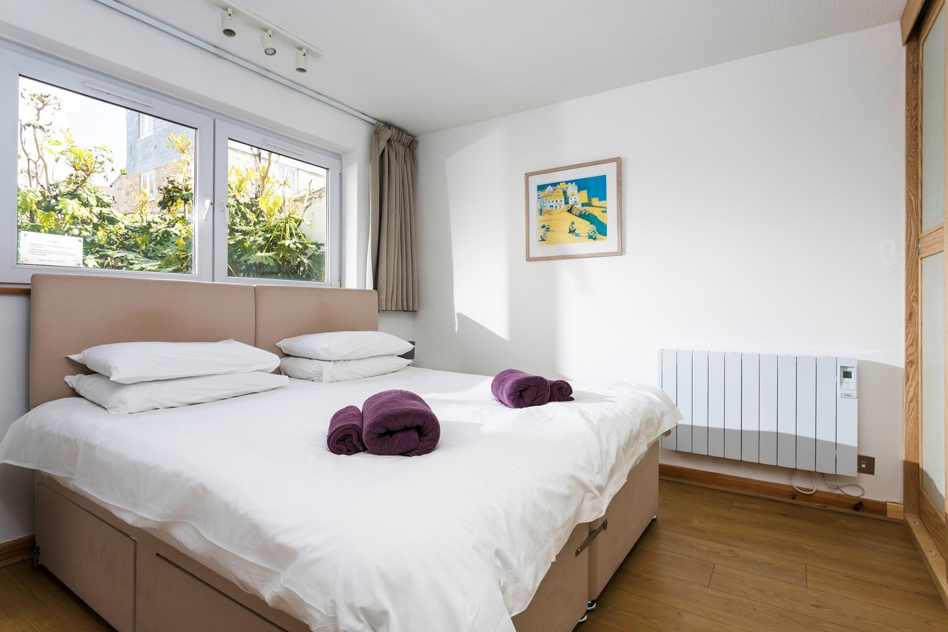 Decorated in calming neutral tones, sink into the bed for a blissful night's sleep. 