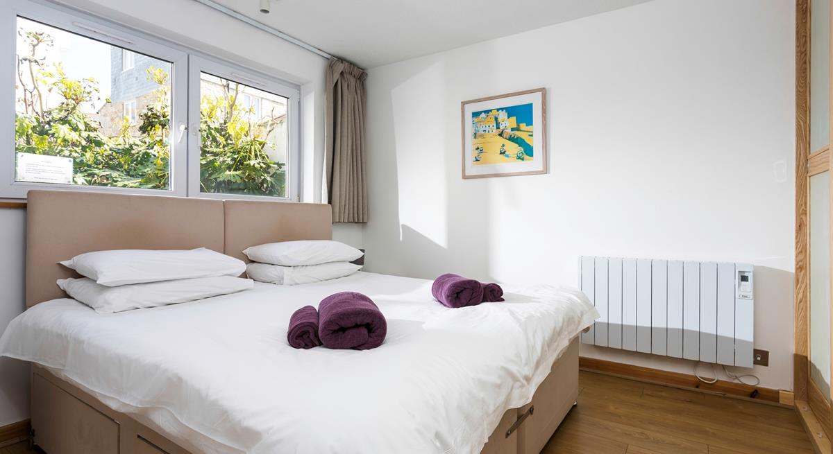 Decorated in calming neutral tones, sink into the bed for a blissful night's sleep. 