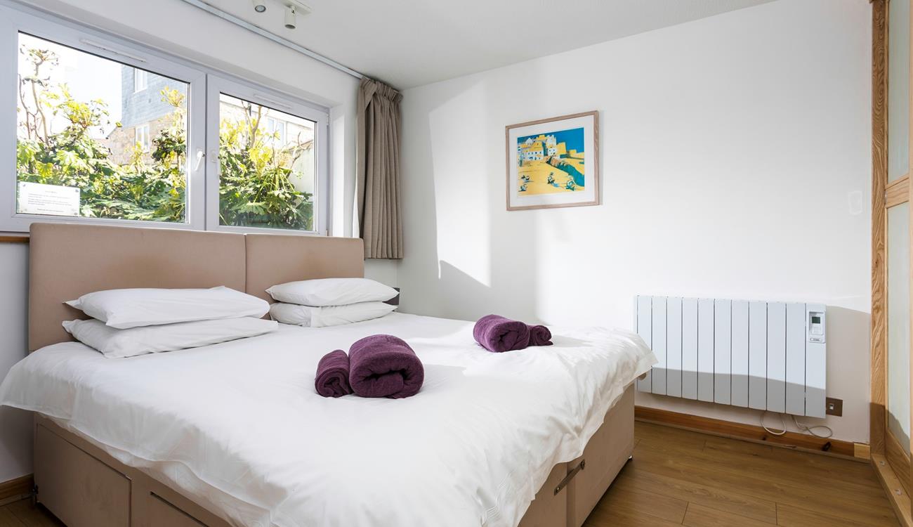 Decorated in calming neutral tones, sink into the bed for a blissful night's sleep. 