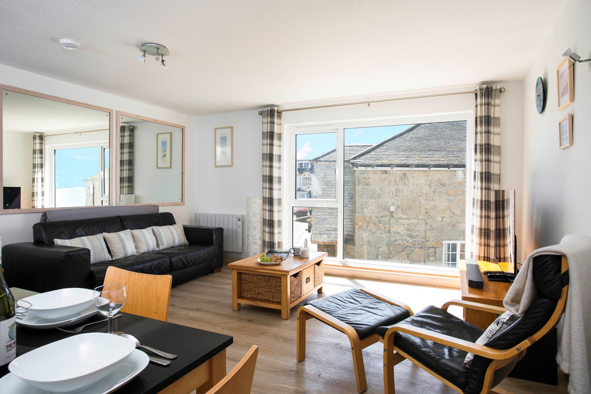 Relax in the light and spacious sitting room. 