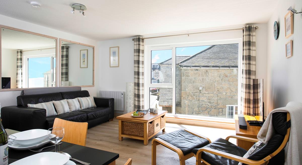 Relax in the light and spacious sitting room. 