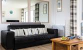 The sofa in the sitting room converts into a bed, with ample space to make yourselves comfortable.  - Thumbnail Image