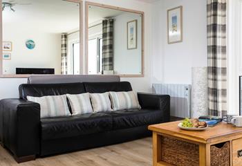 The sofa in the sitting room converts into a bed, with ample space to make yourselves comfortable. 