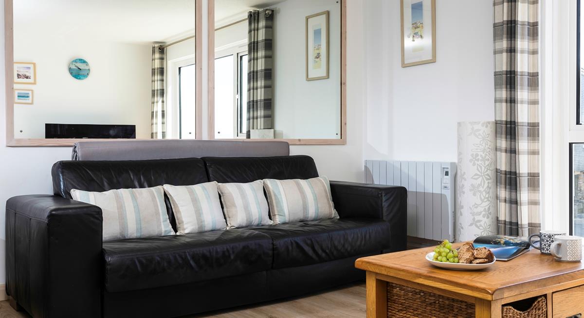 The sofa in the sitting room converts into a bed, with ample space to make yourselves comfortable. 