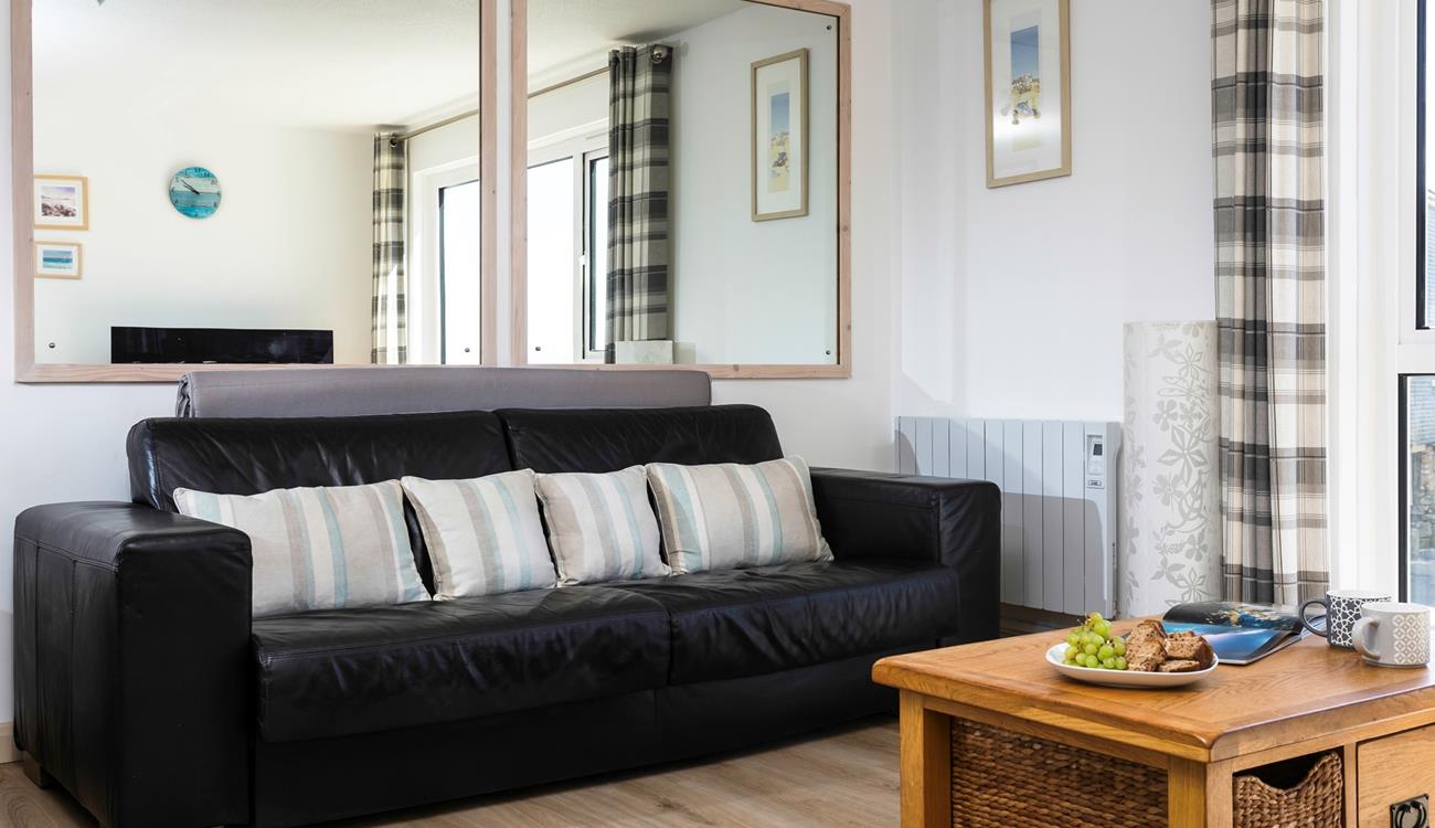 The sofa in the sitting room converts into a bed, with ample space to make yourselves comfortable. 