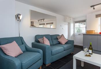 Enjoy a glass of wine on the comfy sofa with harbour views. 