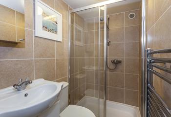 The shower room has a double walk-in shower, perfect for washing away the sand after a day lounging on the beach!
