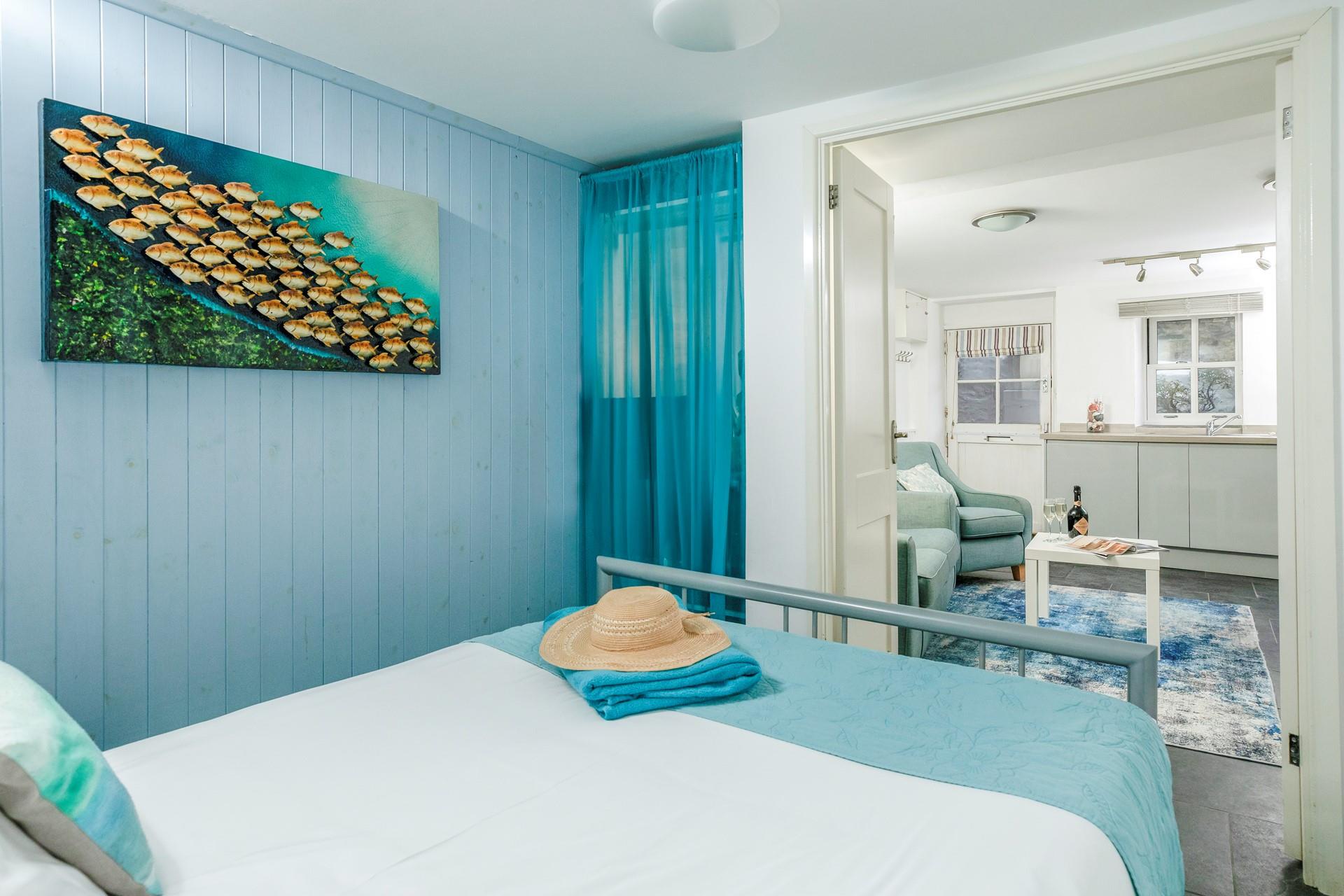 The bedroom is conveniently located on the same level as the living area. 