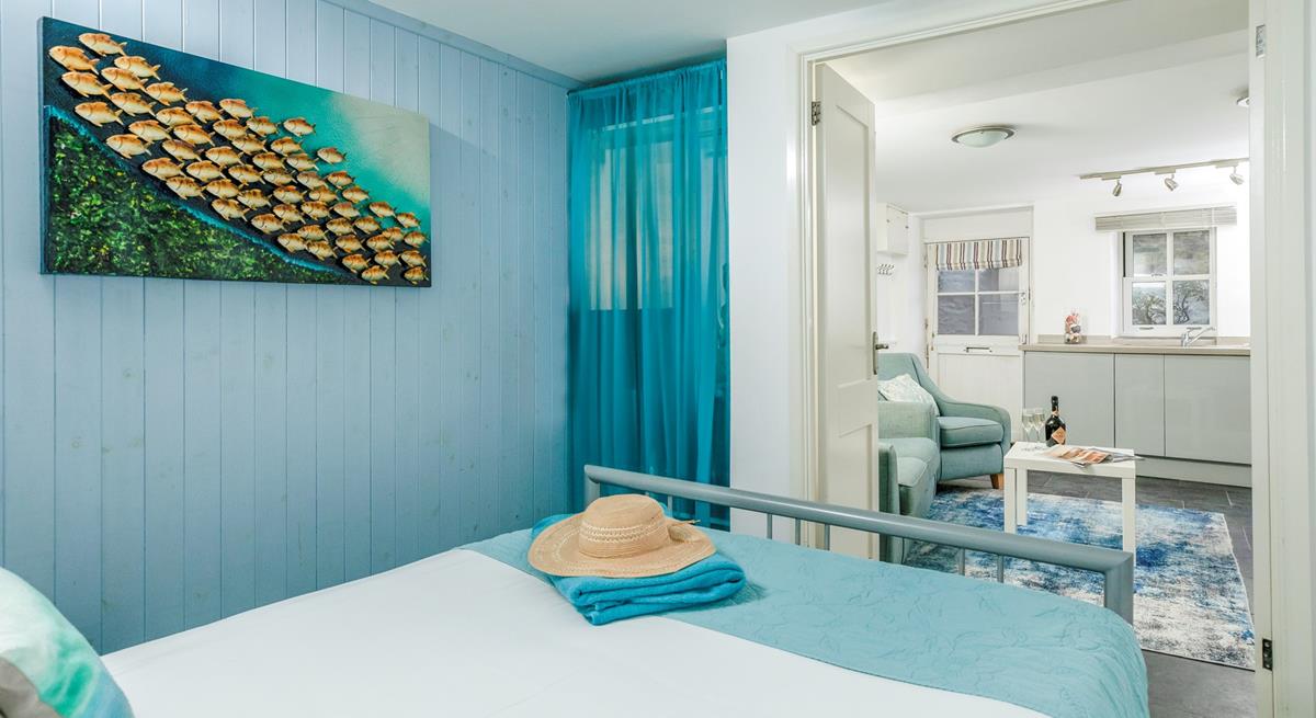 The bedroom is conveniently located on the same level as the living area. 