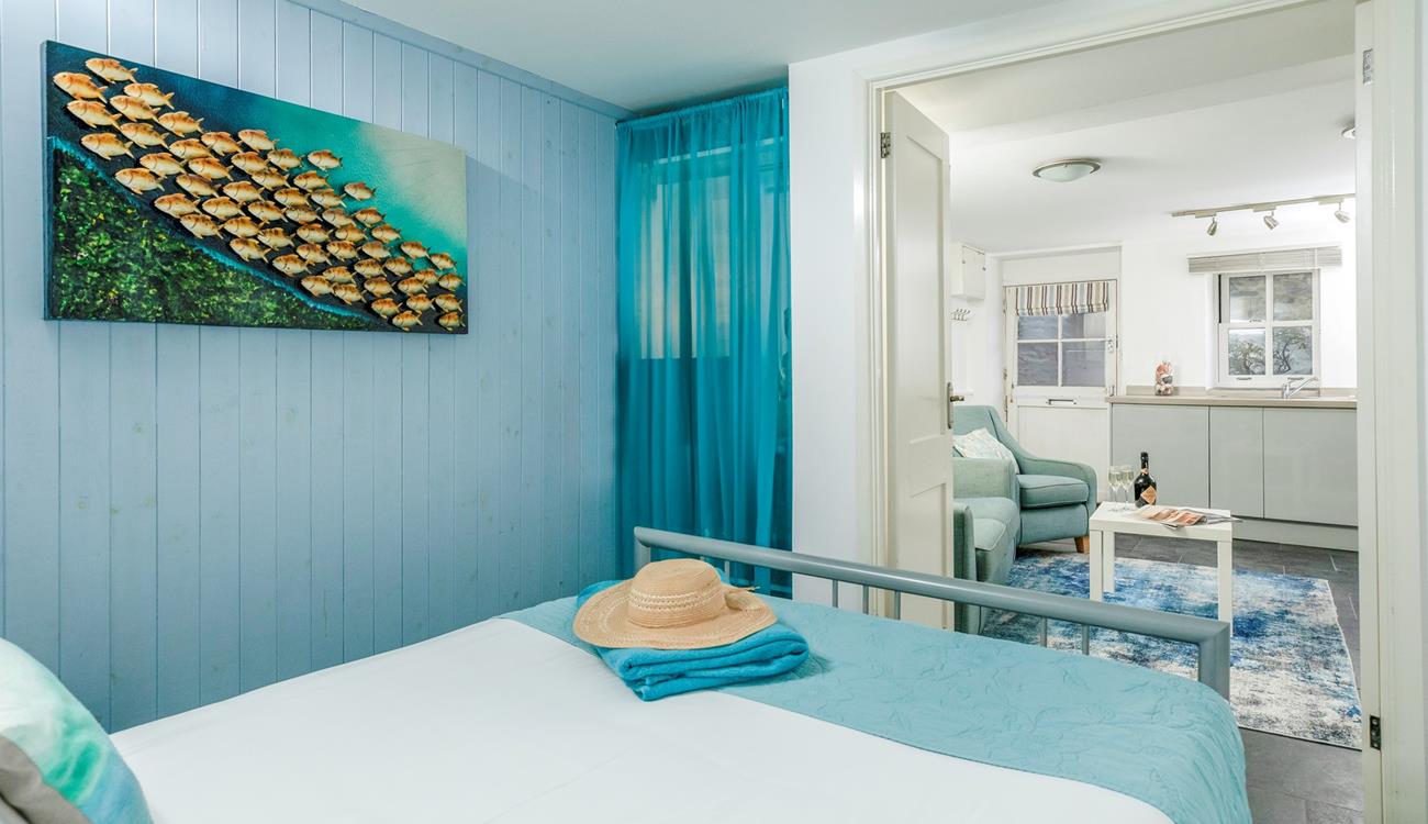 The bedroom is conveniently located on the same level as the living area. 