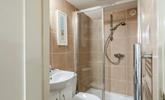The shower room has a double walk-in shower, perfect for washing away the sand after a day lounging on the beach! - Thumbnail Image