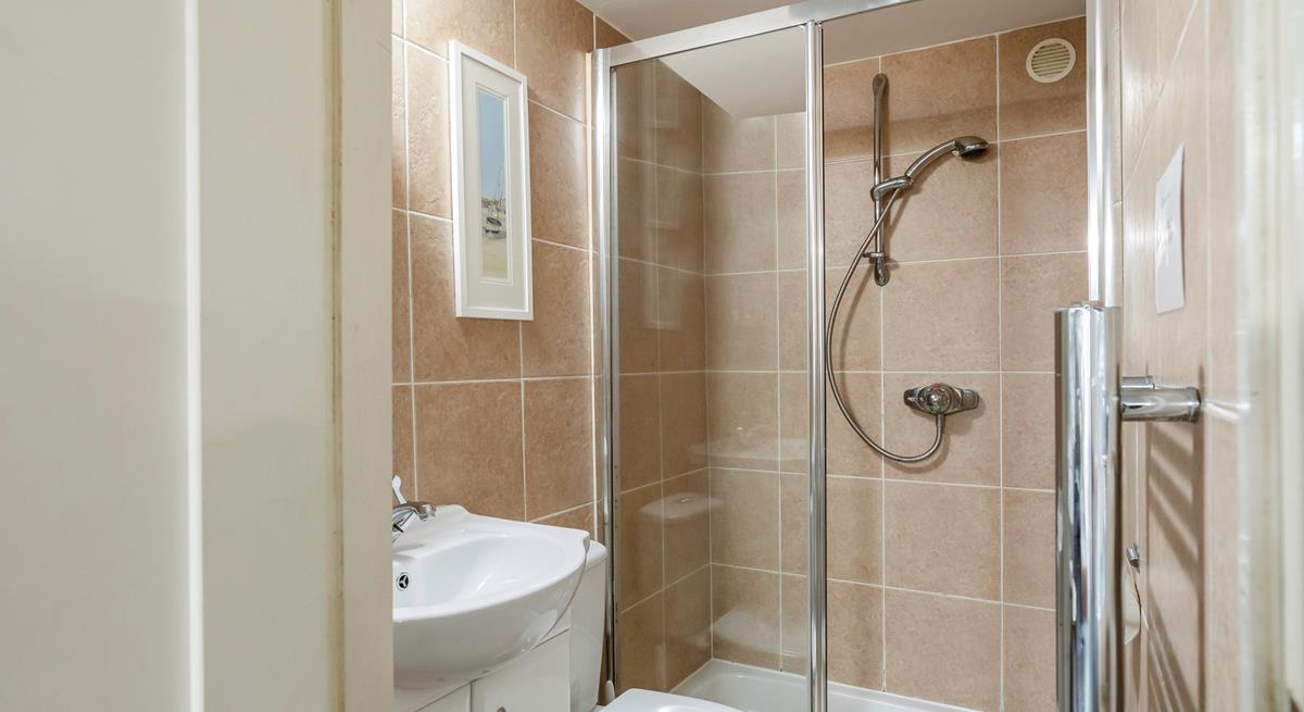 The shower room has a double walk-in shower, perfect for washing away the sand after a day lounging on the beach!