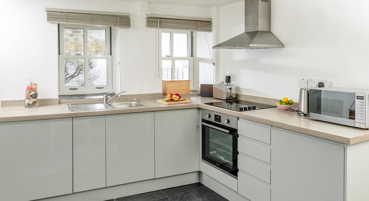 Find everything you need in the spacious kitchen to cook a delicious meal. 