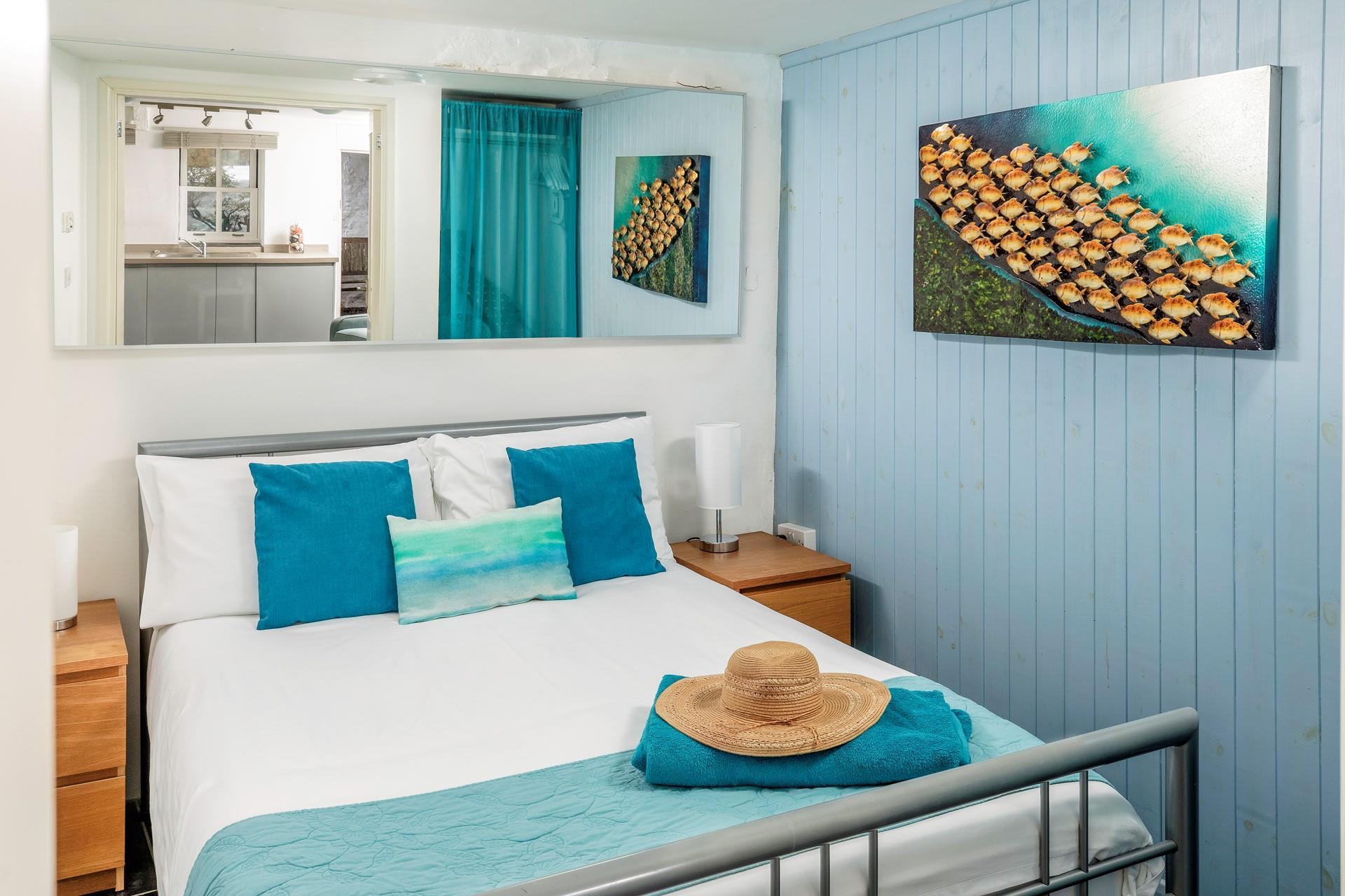 We love the coastal decor in the double bedroom. 