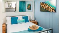 We love the coastal decor in the double bedroom. 