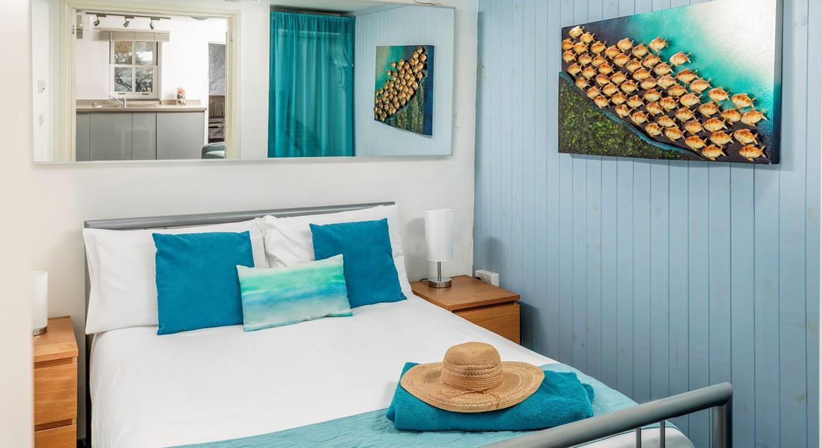 We love the coastal decor in the double bedroom. 