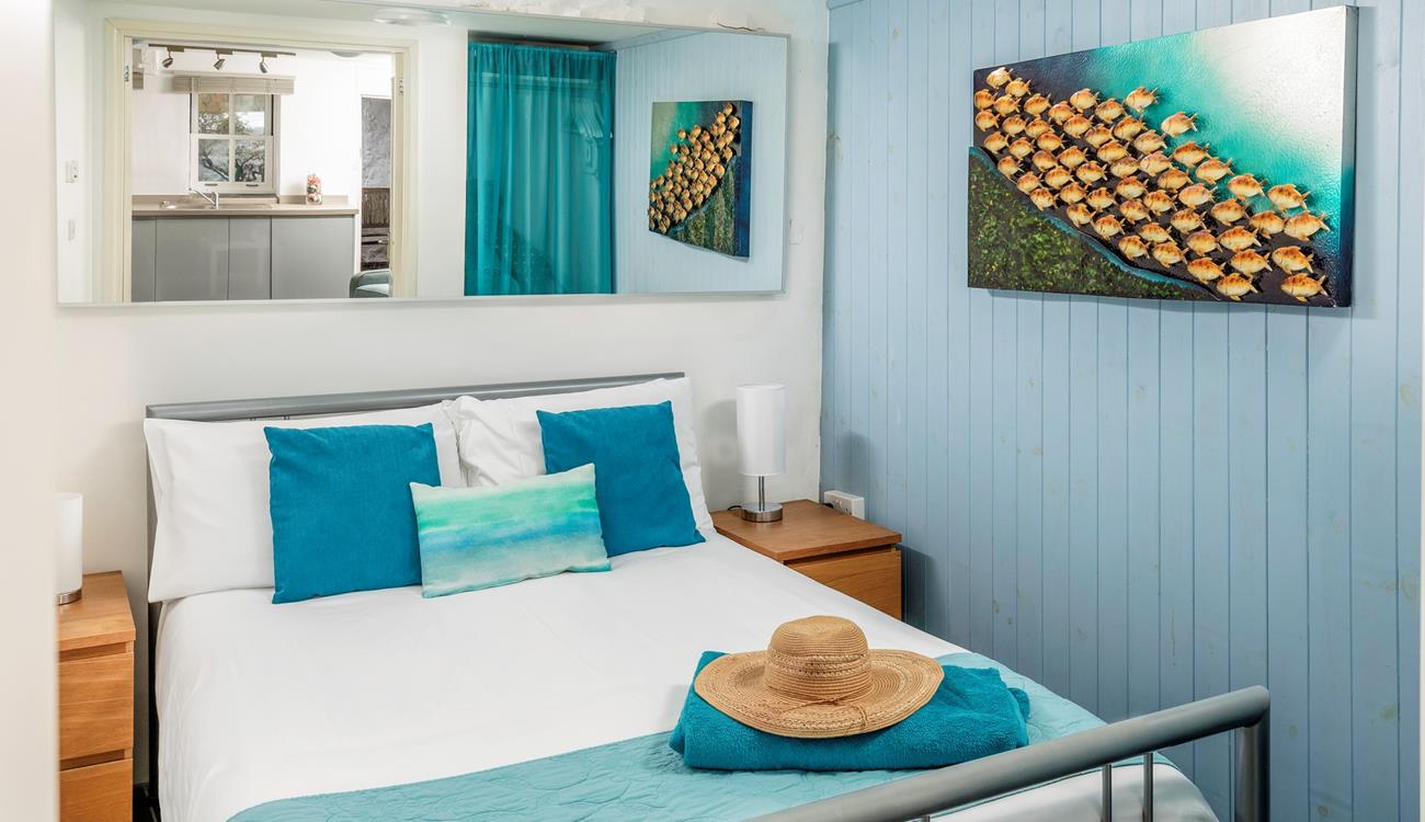We love the coastal decor in the double bedroom. 