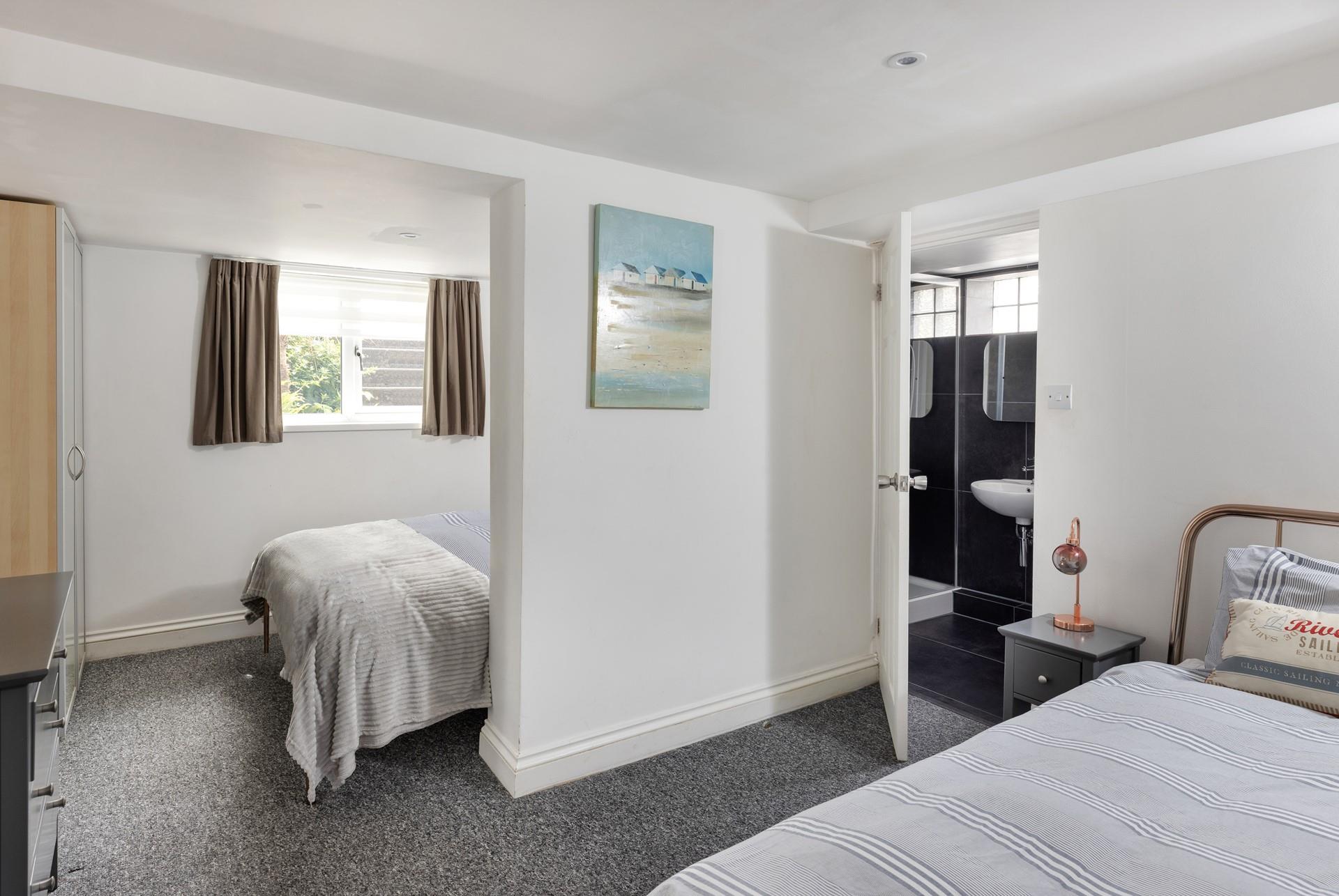 Bedroom 2 has a handy en suite and plenty of storage.