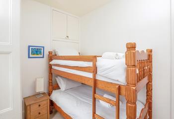 Bedroom 2 has full-size bunk beds which are perfect for children.