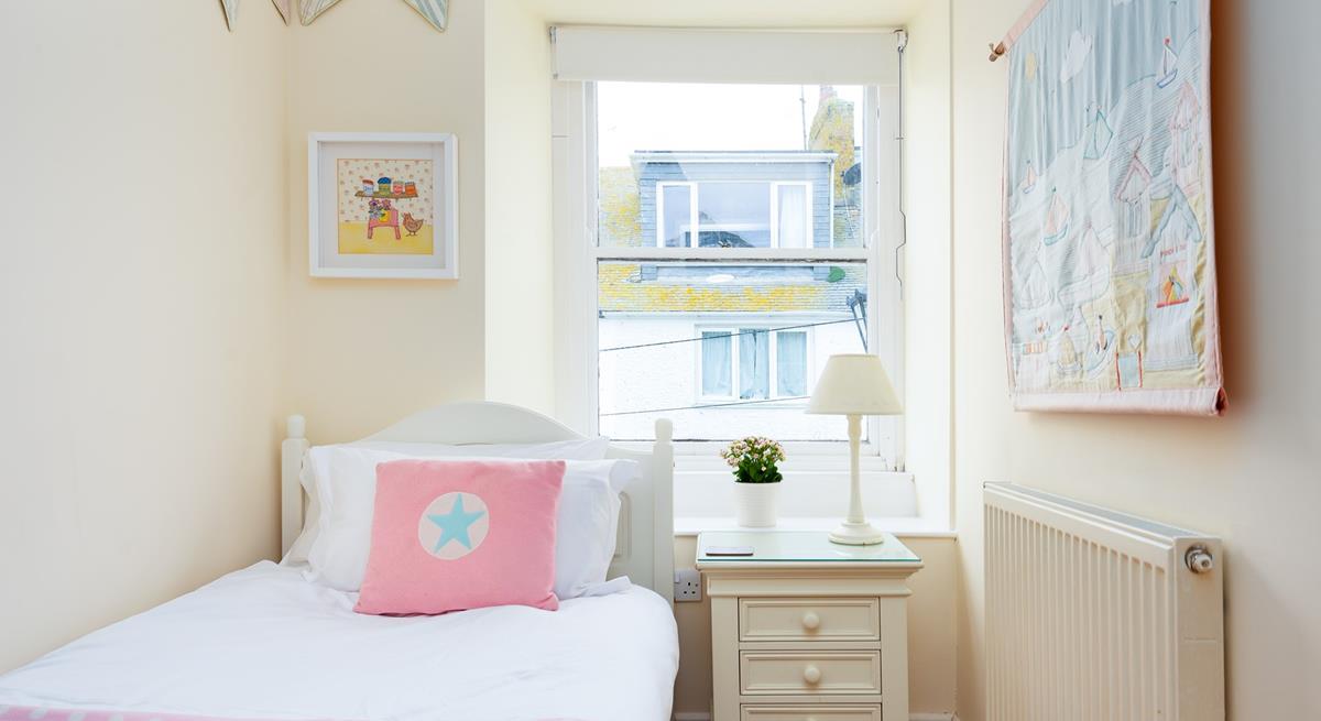 Tucked away in a quiet part of the house, this bedroom will help younger members of your party drift off.