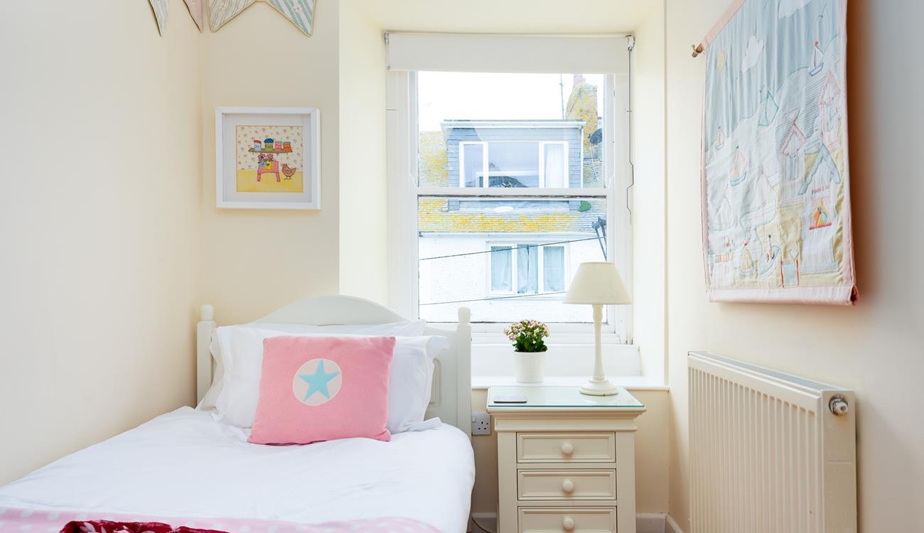 Tucked away in a quiet part of the house, this bedroom will help younger members of your party drift off.