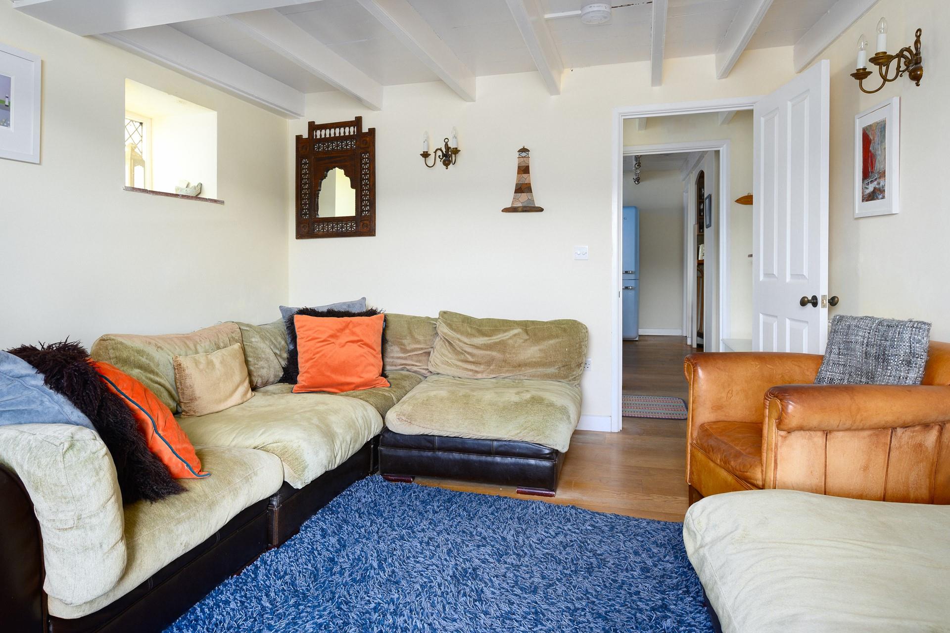 The sitting room mixes colours and textures to create a welcoming space.