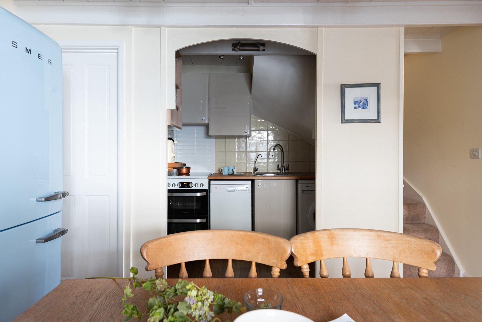 Though compact, the kitchen has everything you need to whip up delicious home-cooked meals.