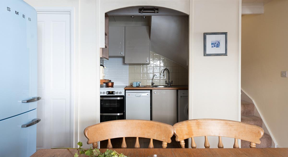 Though compact, the kitchen has everything you need to whip up delicious home-cooked meals.