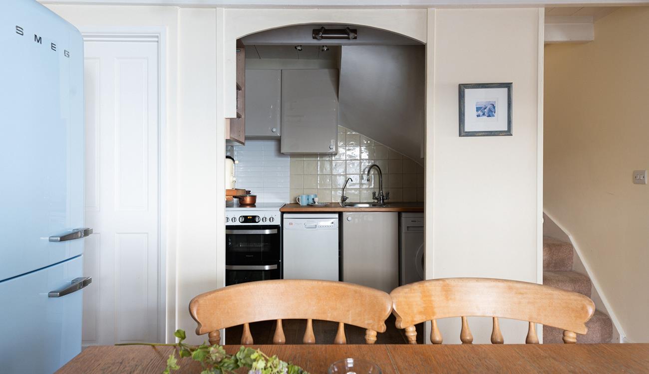 Though compact, the kitchen has everything you need to whip up delicious home-cooked meals.