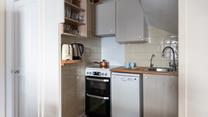 Modern appliances make cooking in this cute kitchen a breeze.