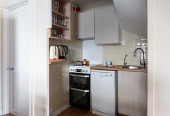 Modern appliances make cooking in this cute kitchen a breeze.