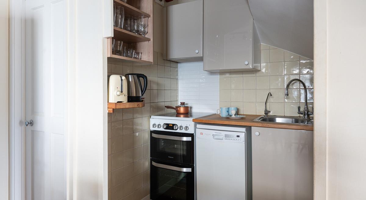 Modern appliances make cooking in this cute kitchen a breeze.