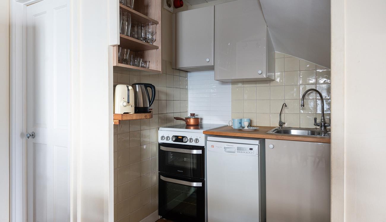 Modern appliances make cooking in this cute kitchen a breeze.