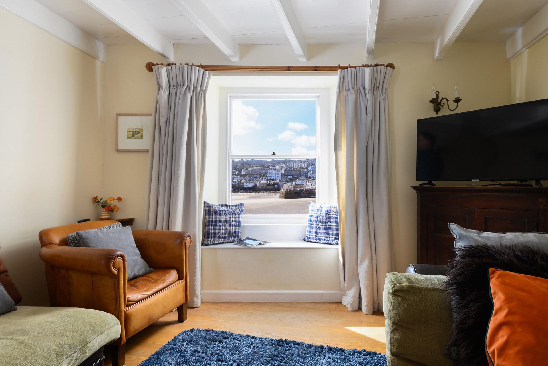 Take a quiet moment to yourself on the cosy armchair and get lost in a good book or simply relax with a hot drink and enjoy the harbour views.