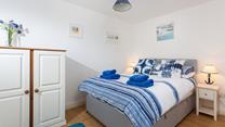 Comfortable crisp linen and super soft towels await in the bedroom.