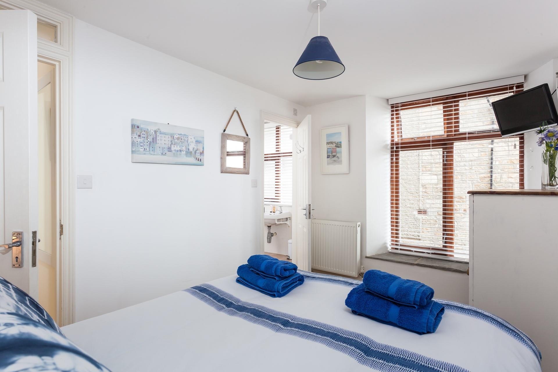 Awake from a dreamy sleep and drift into the en suite to get ready for the day.