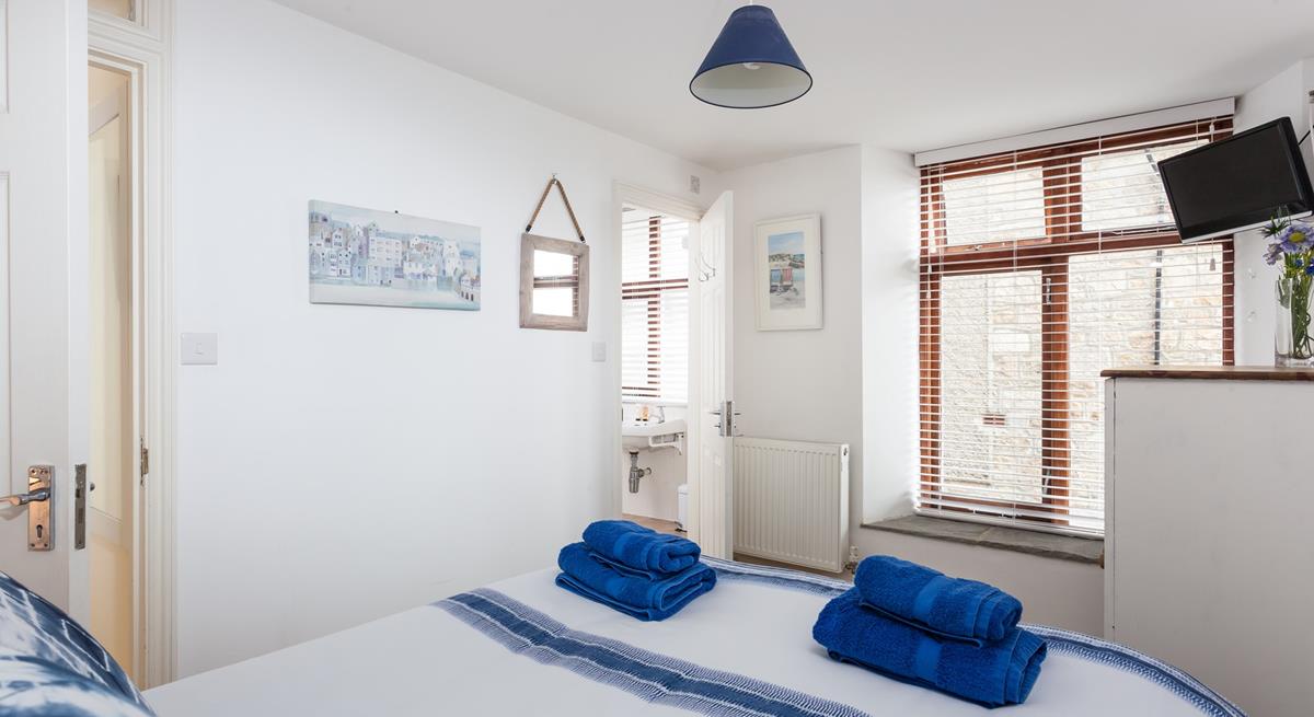 Awake from a dreamy sleep and drift into the en suite to get ready for the day.