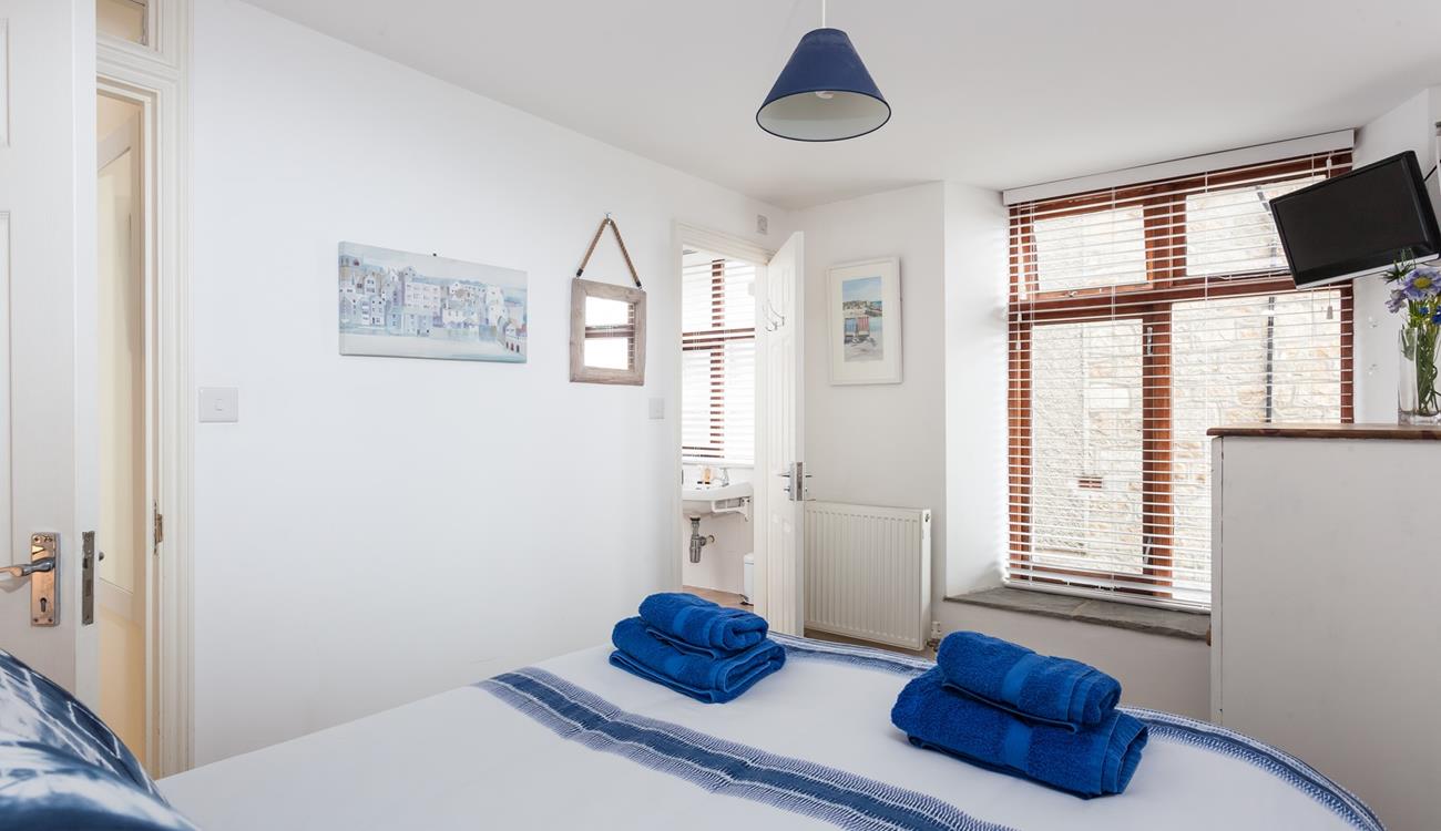 Awake from a dreamy sleep and drift into the en suite to get ready for the day.