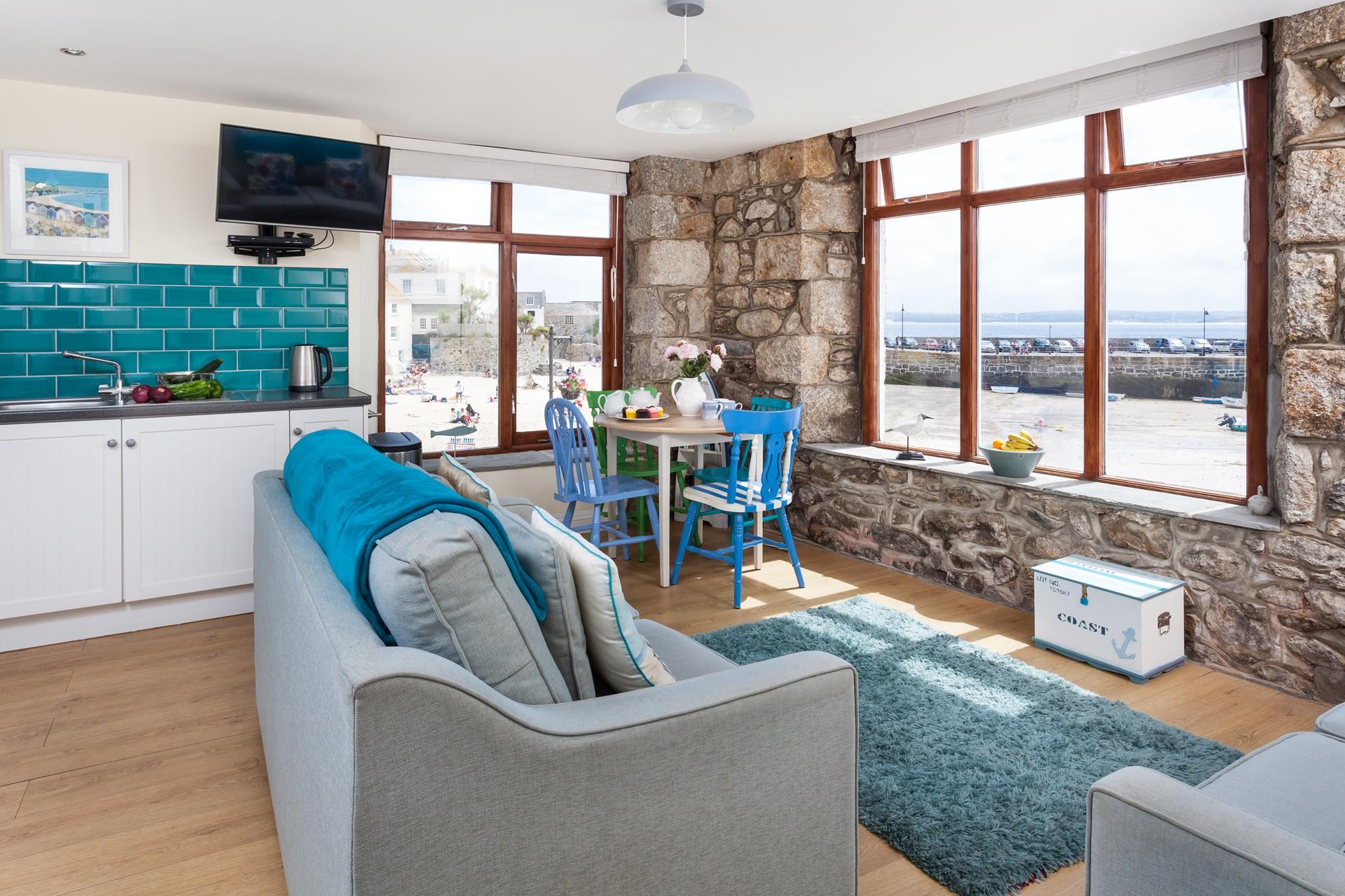 Watch the comings and goings of the harbour from the comfortable sitting room.