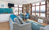Watch the comings and goings of the harbour from the comfortable sitting room. - Thumbnail Image